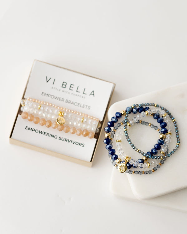 Set of four beaded bracelets - amber, clear, gold and blue clear gold