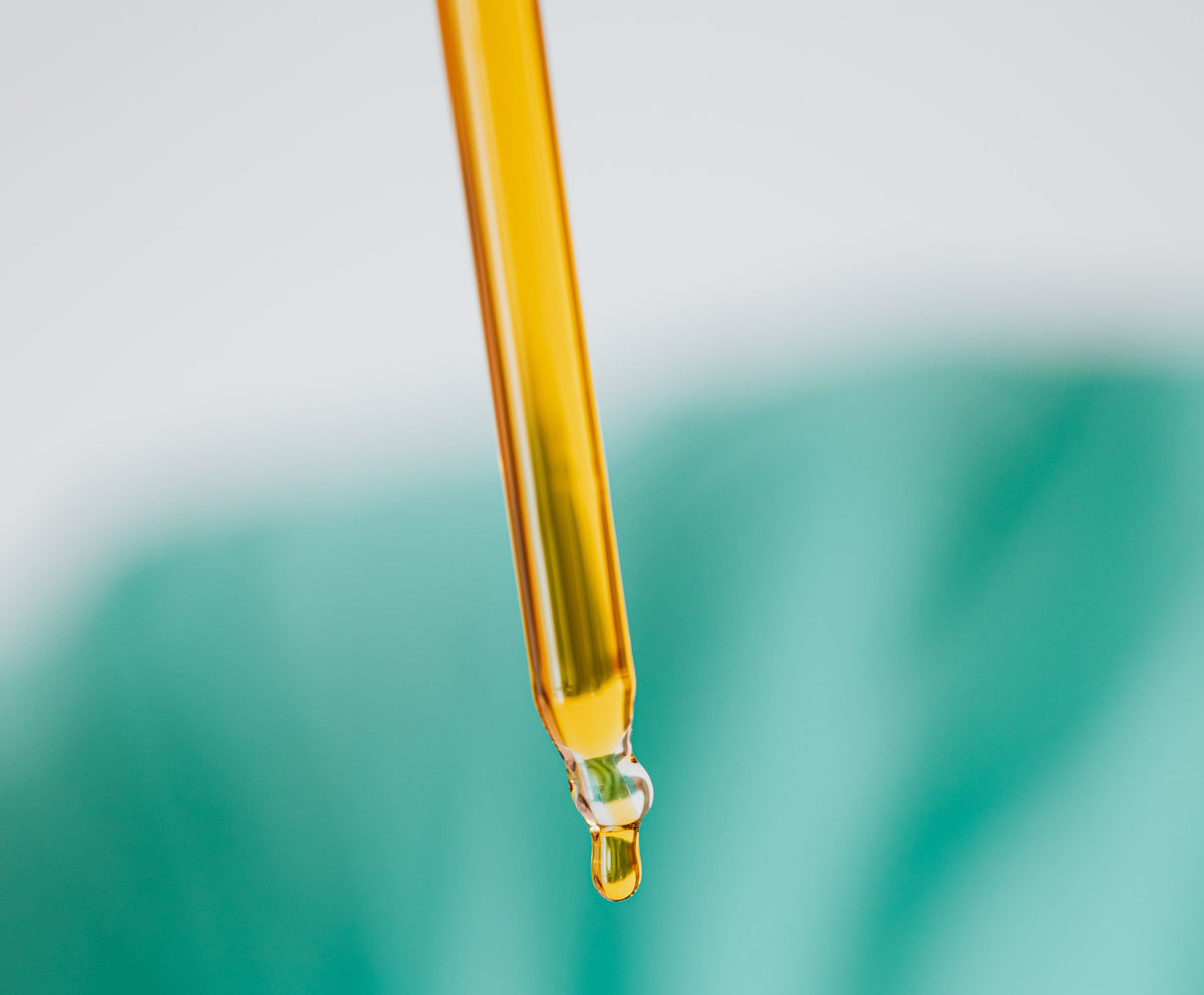 Face Oil dropper with golden oil